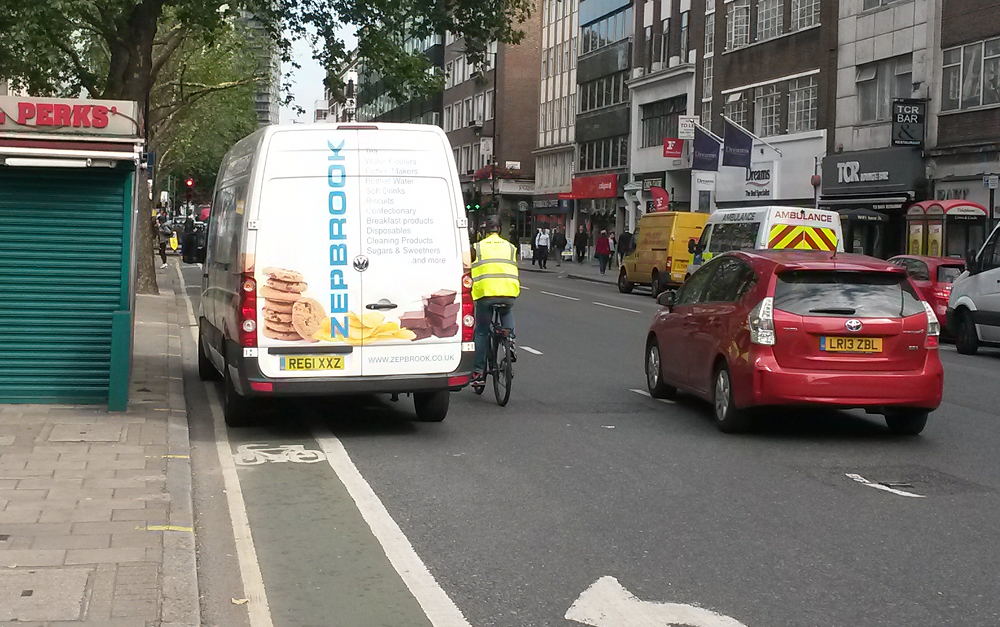 Friday morning. Van blocks cycle lane forcing riders our into the road.