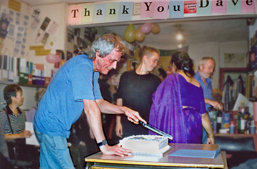 Dave Ferris cutting cake.